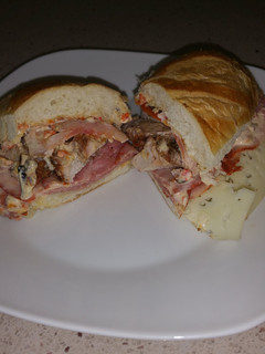 A picture of Grilled Pork Sandwich with Roasted Red Pepper Mayo "El Cumino".