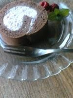 A picture of Chocolate Roll Cake with Pink Raspberry Cream.