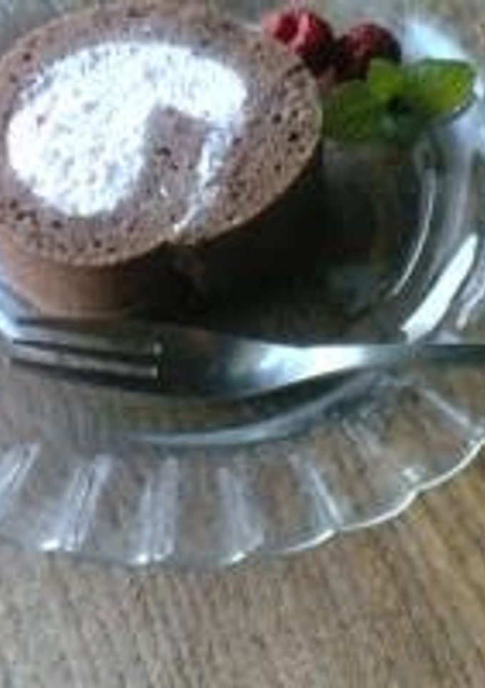 A picture of Chocolate Roll Cake with Pink Raspberry Cream.