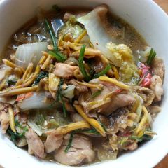 A picture of Thai chicken soup with swedish mushrooms.