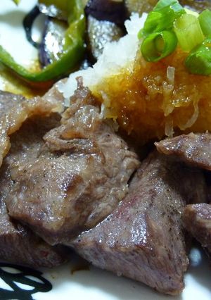 A picture of Grated Garlic and Soy Sauce over Beef Steak.