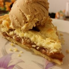 A picture of Apple pie with crockan ice cream.