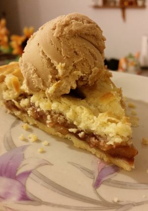 A picture of Apple pie with crockan ice cream.