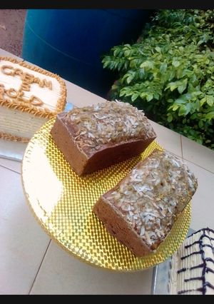 A picture of Banana loaf with coconut topping.