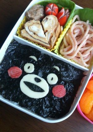 A picture of Noriben (Rice Covered with Nori Dipped in Soy Sauce) with Kumamon, the Kumamoto Prefecture Mascot.