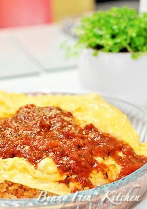 A picture of Omurice In Tomato Sauce.