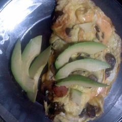 A picture of mushroom cheese jalapenos de vinagre and avacado omelet.