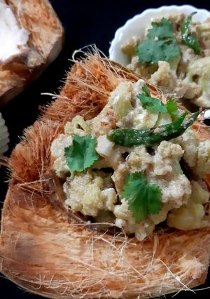 A picture of Phulkopir Dab Malai/ Malai Cauliflower with Green Coconut.