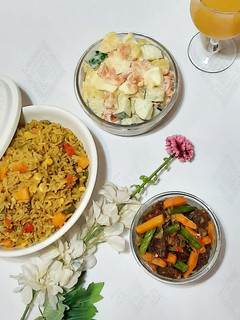A picture of Fried rice with Irish potato salad.