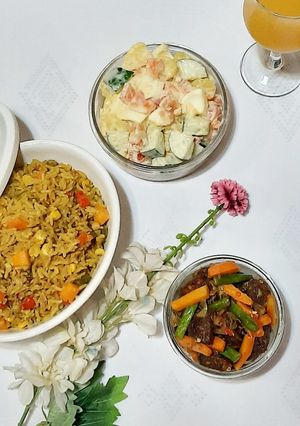 A picture of Fried rice with Irish potato salad.