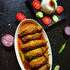 A picture of Chingri Potoler Dolma(Stuffed Parwal).