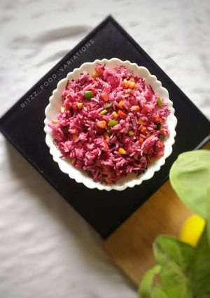 A picture of Beetroot rice with loaded veggies.