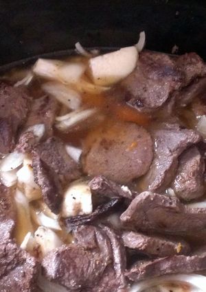 A picture of Deer steak With potatoes onions carrots.