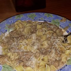 A picture of Hamburger gravy over egg noodles.