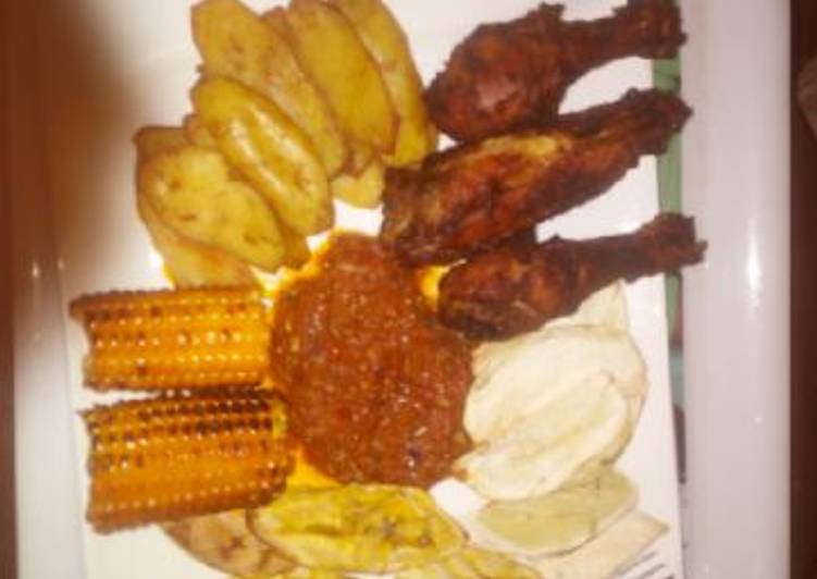 Simple Way to Make Homemade Fried plantain,Fried chicken,roasted corn with sauce