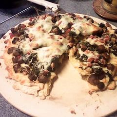 Italian Sausage Spinach Ricotta Cheese Pizza A picture of Italian Sausage Spinach Ricotta Cheese Pizza.