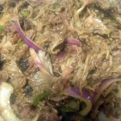 A picture of low and slow smoked pulled pork.