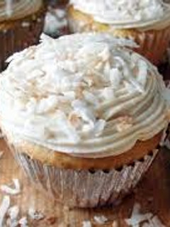 A picture of COCONUT CUPCAKES WITH WHITE CHOCOLATE BUTTERCREAM.