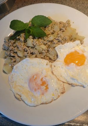 A picture of Huevos Rancheros with Green Chorizo and Potatoes.