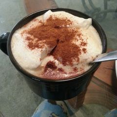 Coffee with cinnamon and whipped cream A picture of Coffee with cinnamon and whipped cream.