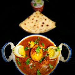 A picture of Kollhapuri Egg Curry.