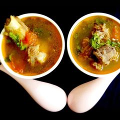 A picture of Mutton/ goat bone soup in pressure cooker.