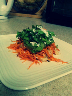 A picture of Quick yam noodles with "alfredo" sauce and greens.