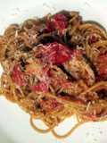 Baked breadcrumb tomatoes on garlic parmesan spaghettini.