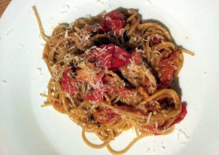 Baked breadcrumb tomatoes on garlic parmesan spaghettini.