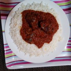 A picture of White rice and stew.
