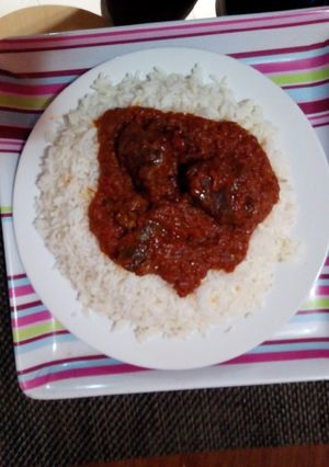 A picture of White rice and stew.