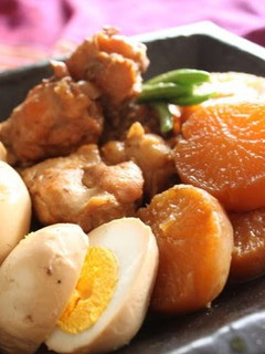 A picture of Rich Simmered Chicken Wing Drumettes, Daikon Radish and Eggs.