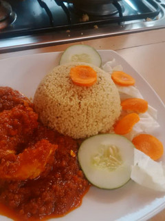 A picture of Curry rice and tomato stew.