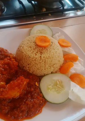 A picture of Curry rice and tomato stew.