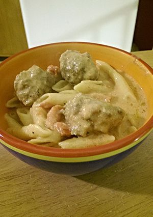 A picture of Creamy tomato penne and meatballs.