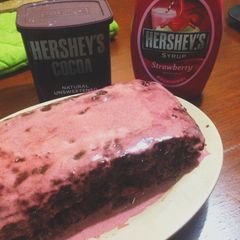 A picture of Choco-Berry Moist Cake With Strawberry Sauce.
