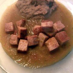 A picture of ham with salsa.