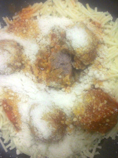 A picture of spaghetti and meatballs.