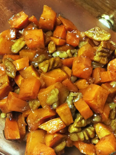 A picture of Honey and cinnamon roasted sweet potatoes and pecans.