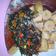 A picture of Unripe plaintain,vegetables with dry fish.