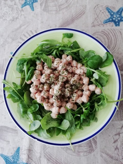 Una foto de Nido de garbanzos con rúcula