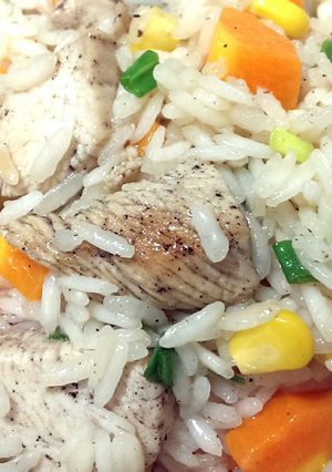 A picture of Rice with chicken and vegetables.