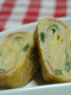 A picture of Japanese Style Omelet for Bento with Crab Sticks and Green Beans.