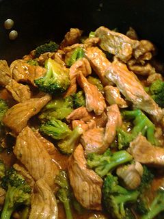 A picture of pork and broccoli.