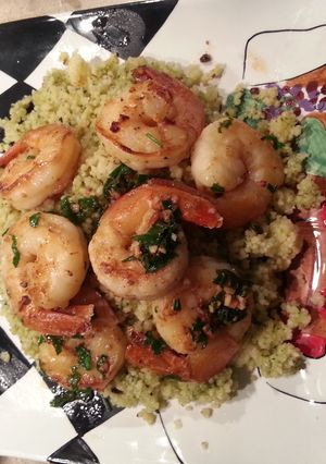 A picture of Pesto cous cous with shrimp.