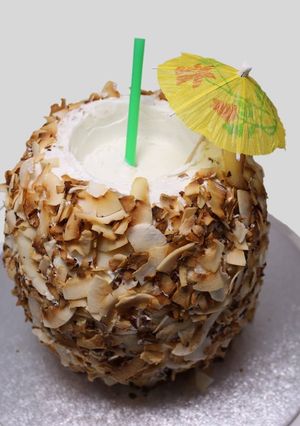 Una foto de Pastel "cóctel en coco" (sabor coco)