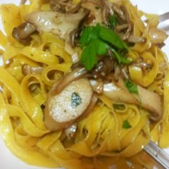 A picture of Butter Sautéed King Oyster Mushrooms on Fresh Fettuccine.