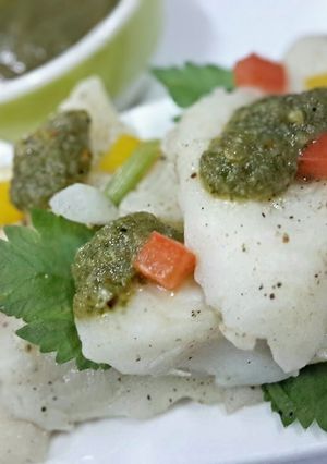 A picture of Poached fish with Lime and Cilantro.