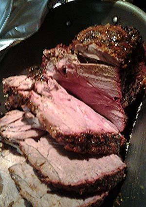 A picture of smoked leg of lamb.