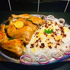 A picture of Zereshk Polo Morgh - Persian Barberry Rice with Chicken.
